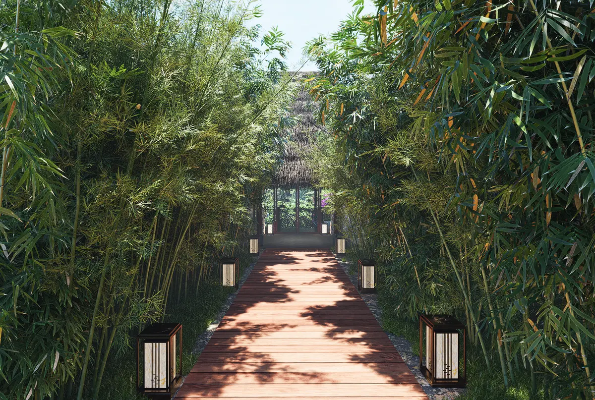 Lantern-lit timber boardwalk through a dense bamboo avenue at a resort