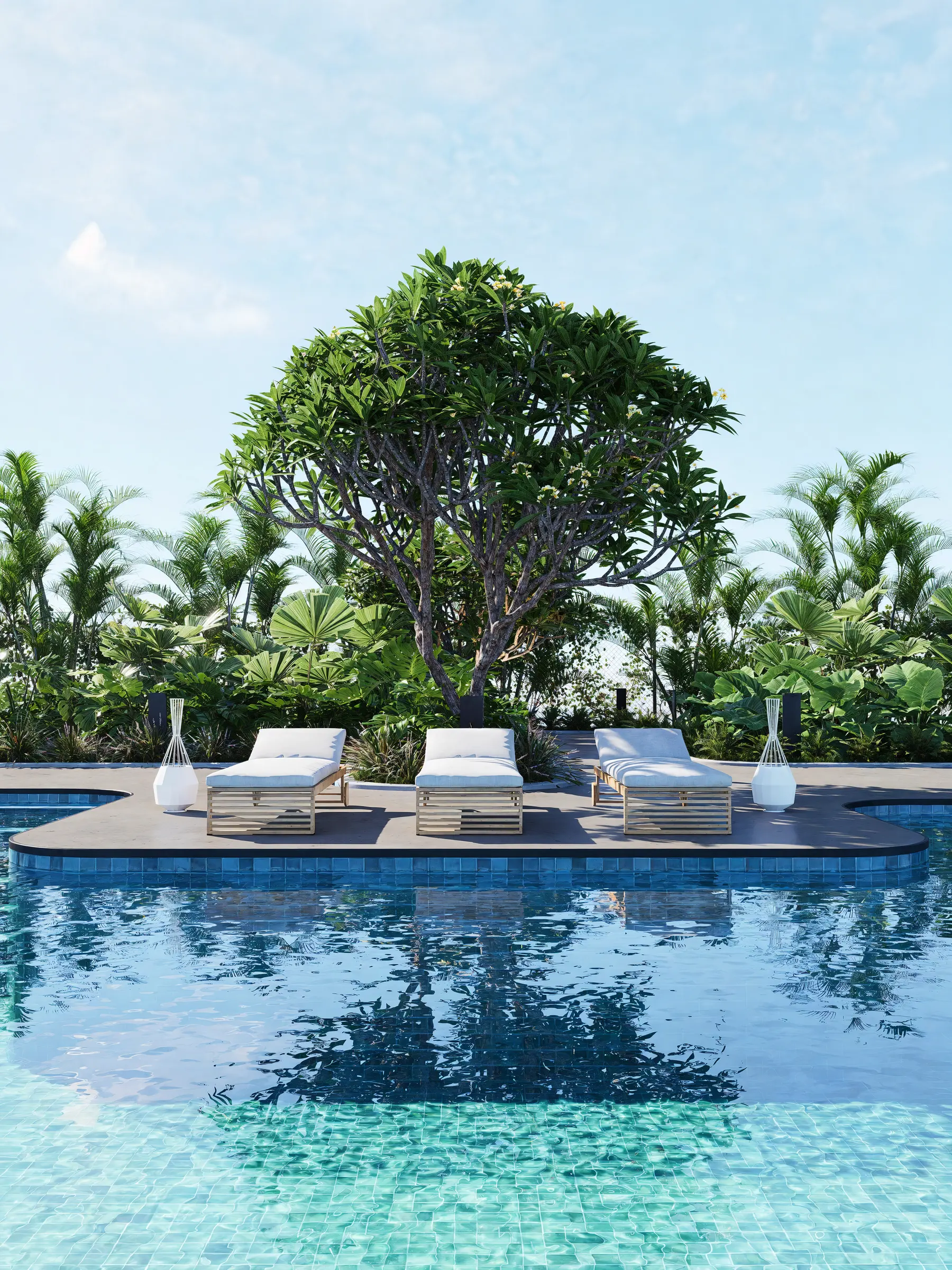 Resort pool terrace with sun loungers beneath a spreading tree